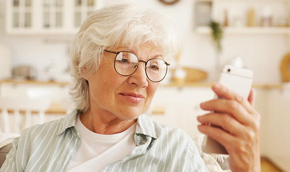 Freepik_attractive-modern-senior-female-pensioner-in-round-glasses-sitting-on-sofa-holding-generic-cell-phone-reading-sms-retired-gray-haired-woman-browsing-internet-using-4-g-wireless-connection_shurkin_son.jpg