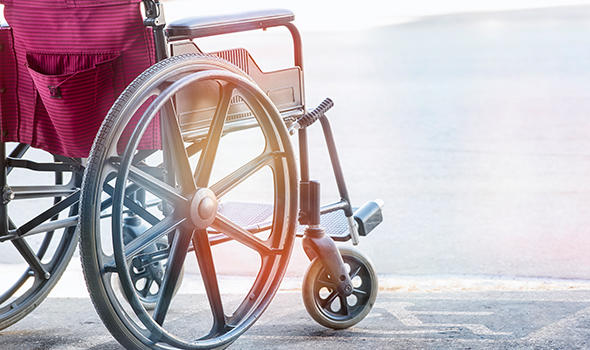 Freepik_close-up-view-empty-wheelchair-with-pavement-handicap-symbol_nampix.jpg