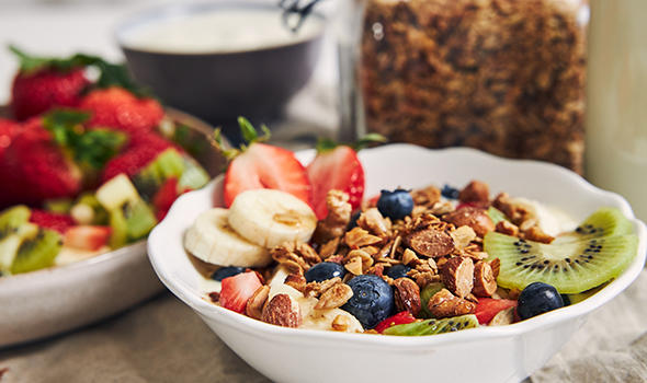 Freepik_bowls-of-granola-with-yogurt-fruits-and-berries-on-a-white-surface_wirestock.jpg