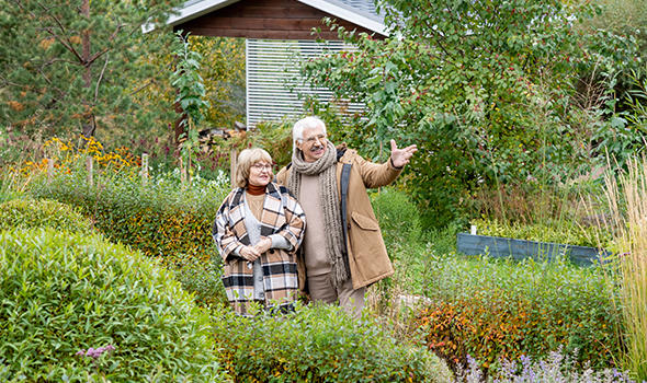 Freepik_happy-senior-man-in-warm-casualwear-pointing-at-green-plants-growing-in-the-garden-while-talking-to-his-wife-between-bushes-and-trees_pressmaster.jpg