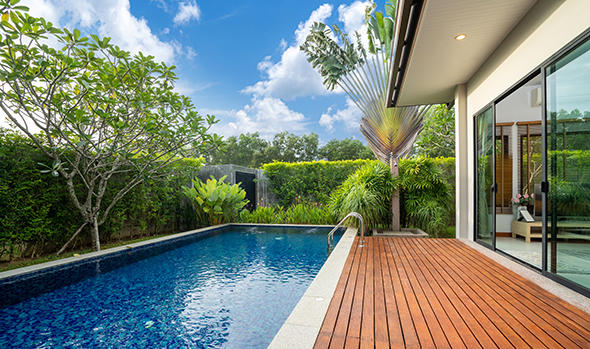Freepik_swimming-pool-and-decking-in-garden-of-luxury-home_poyoky.jpg