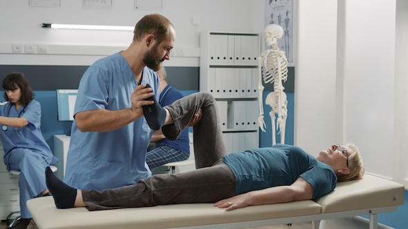 male-physician-doing-legs-raise-procedure-with-senior-patient-in-orthopedic-cabinet-osteopath-stretching-muscles-to-increase-mobility-and-cure-elder-woman-with-physical-injury.jpeg