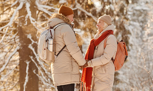 Freepik_side-view-portrait-of-smiling-senior-couple-enjoying-hike-in-winter-forest-and-holding-hands-in-sunl_seventyfour.jpg